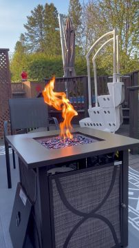 Spring evening gas fire pit on the terrace